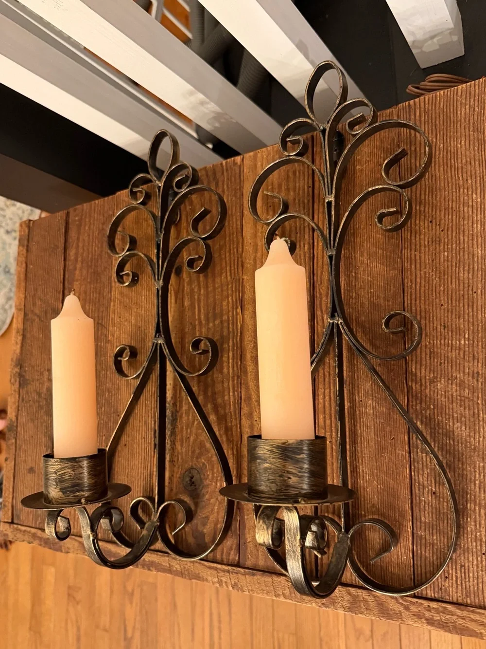 Rustic Scroll Metal Wall Sconce Pair with Cream Candles